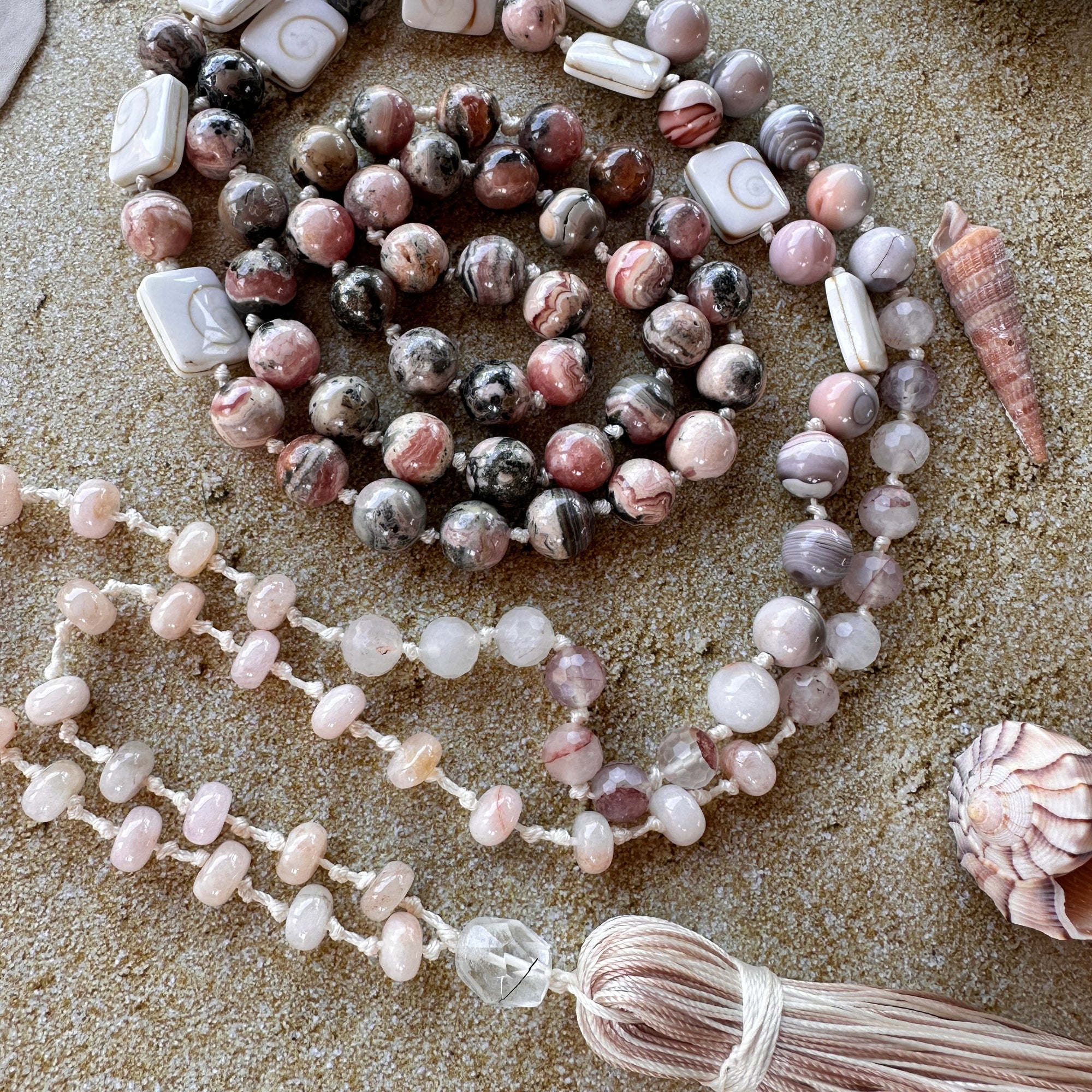 Handcrafted mala with vibrant seashell-inspired beads