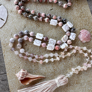 Handcrafted mala with vibrant seashell-inspired beads